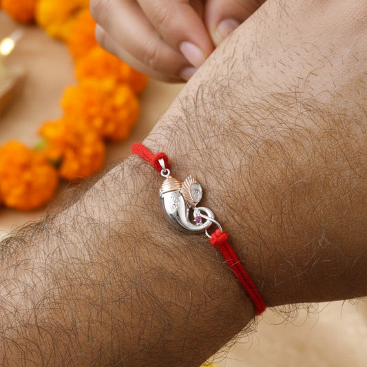 925 Silver Ganesha Trunk Rakhi | Two-Tone Polished Charm on Red Thread - Zirak Silver
