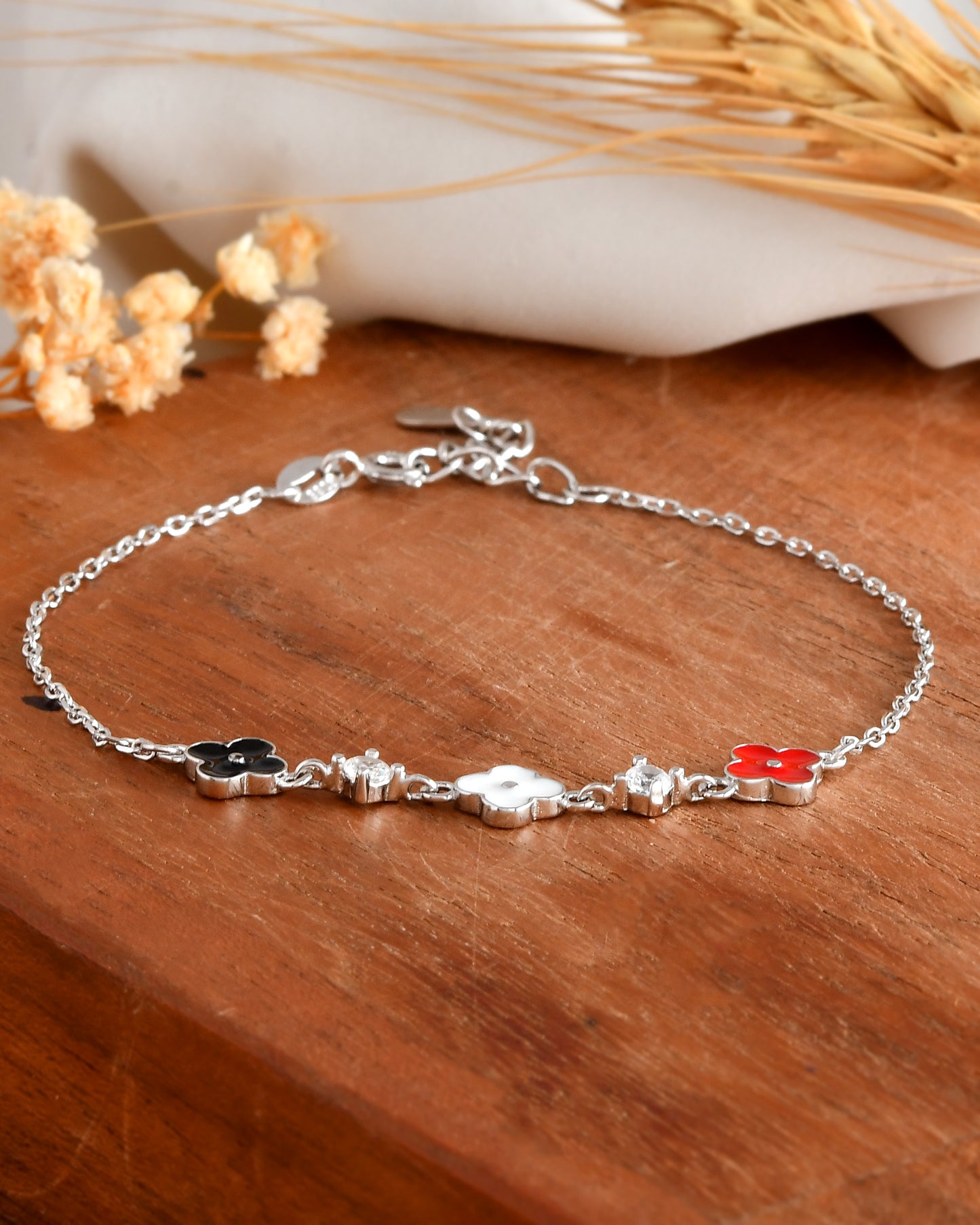 Sterling Silver Tricolor Clover & CZ Station Bracelet – Black, White & Red Enamel Flowers