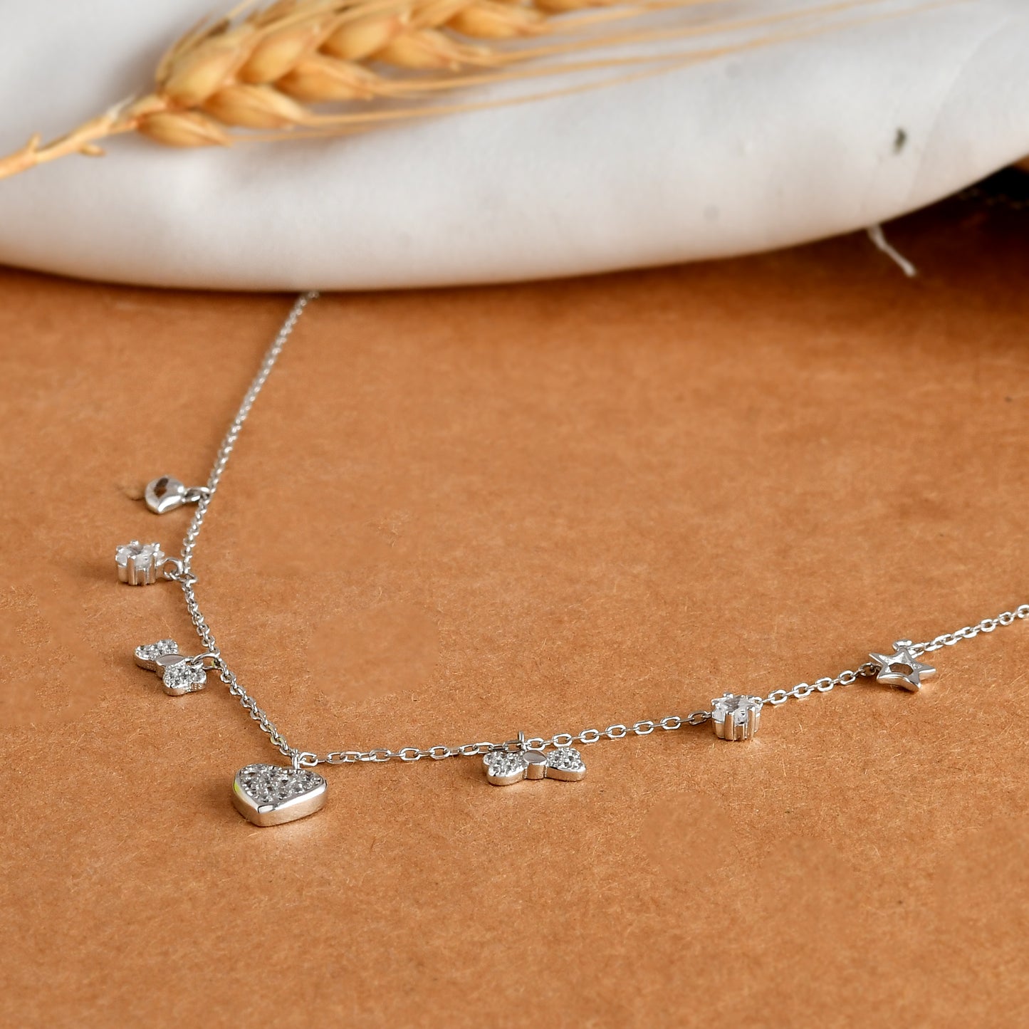 Sterling Silver Mixed-Charm Necklace – Pavé Heart, Star, Bow & CZ Dangles