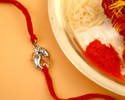 925 Silver Ganesh Ji Rakhi with Rose Gold Accents on Red Thread - Zirak Silver