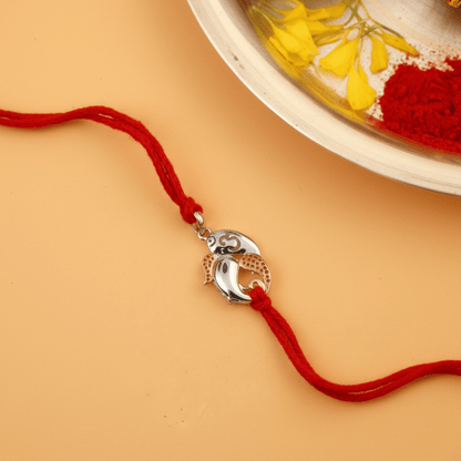 925 Silver Ganesh Ji Rakhi with Rose Gold Accents on Red Thread - Zirak Silver