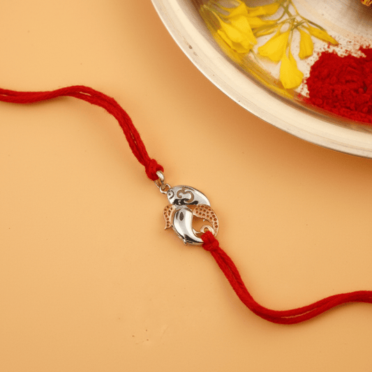 925 Silver Ganesh Ji Rakhi with Rose Gold Accents on Red Thread - Zirak Silver