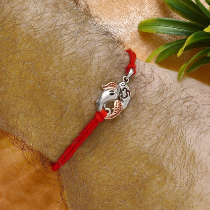 925 Silver Ganesh Ji Rakhi with Rose Gold Accents on Red Thread - Zirak Silver