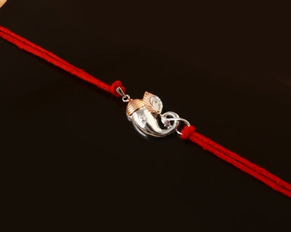 925 Silver Ganesha Trunk Rakhi | Two-Tone Polished Charm on Red Thread - Zirak Silver