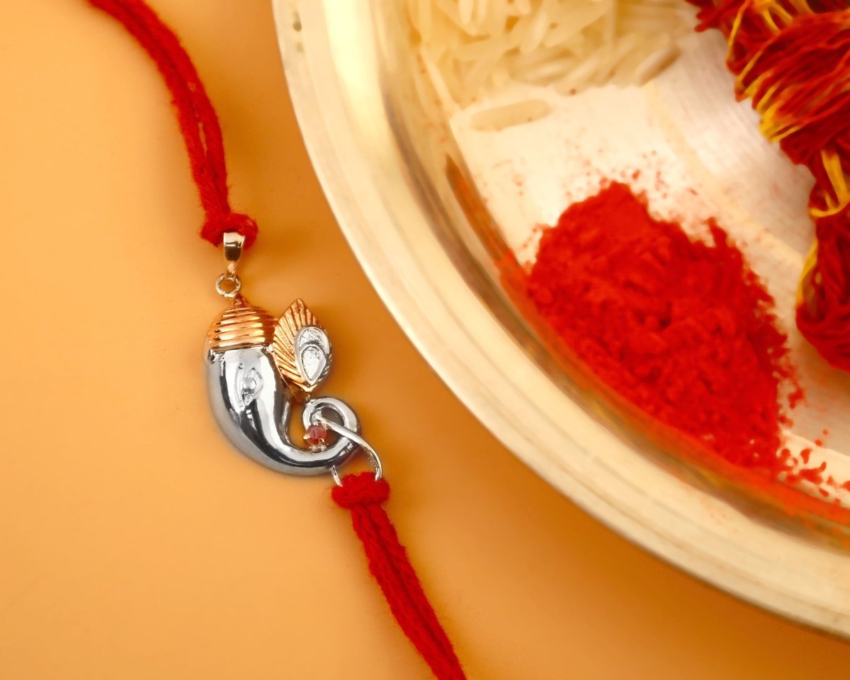 925 Silver Ganesha Trunk Rakhi | Two-Tone Polished Charm on Red Thread - Zirak Silver