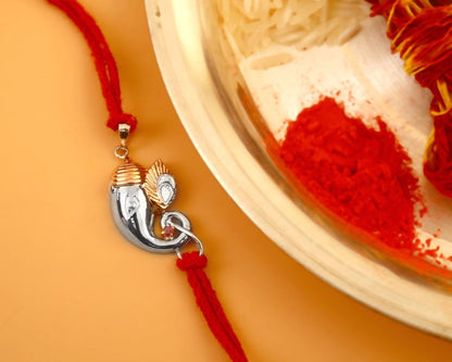 925 Silver Ganesha Trunk Rakhi | Two-Tone Polished Charm on Red Thread - Zirak Silver