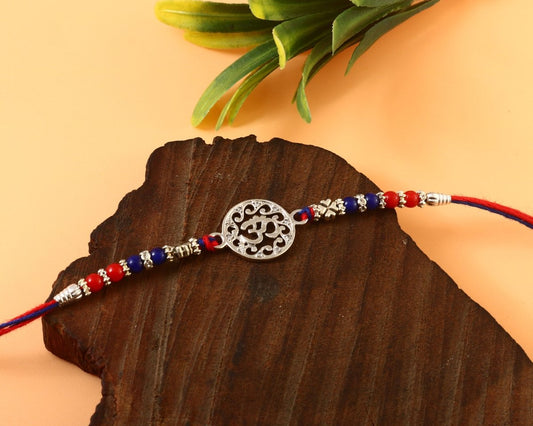 925 Silver Om Rakhi | Traditional Red-Blue Beaded Thread with Intricate Om Symbol for Men - Zirak Silver