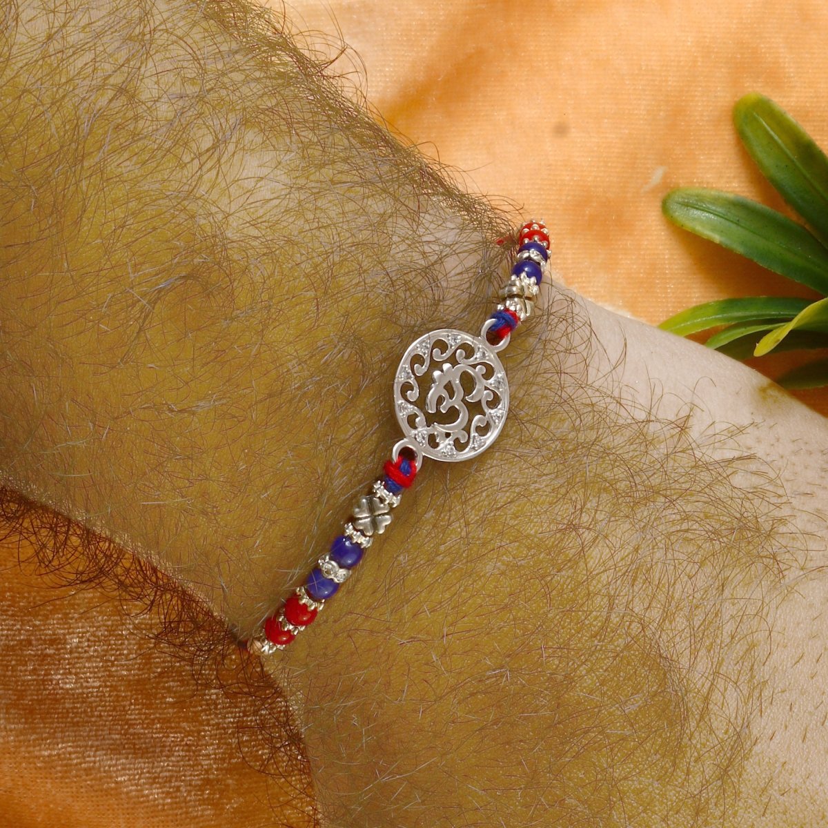 925 Silver Om Rakhi | Traditional Red-Blue Beaded Thread with Intricate Om Symbol for Men - Zirak Silver
