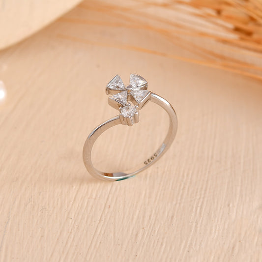 Sterling Silver Pinwheel Ring with Trillion-Cut CZ & Round Solitaire – Modern Open Flower Band