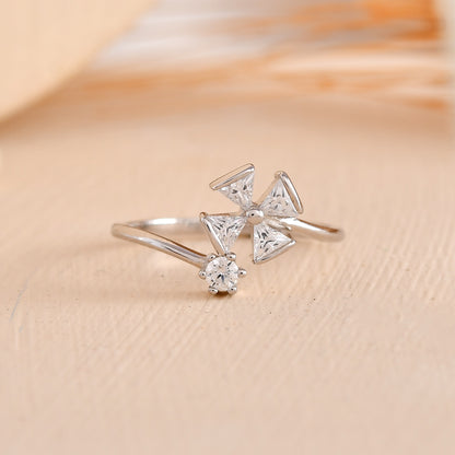 Sterling Silver Pinwheel Ring with Trillion-Cut CZ & Round Solitaire – Modern Open Flower Band