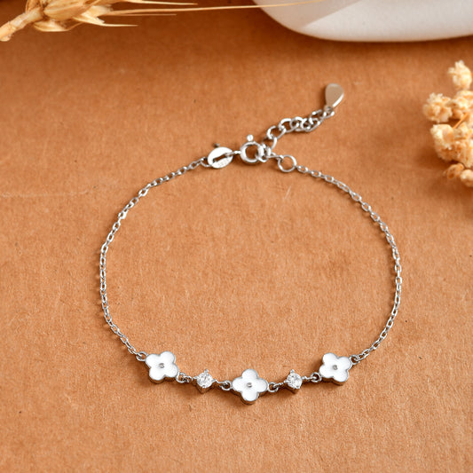 Sterling Silver Clover Bracelet – White Enamel Charms & Cubic Zirconia Sparkle