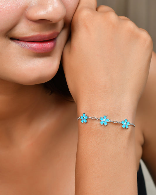 Sterling Silver Blue Enamel Flower Charm Bracelet with Cubic Zirconia Centers – Adjustable Floral Jewelry Gift