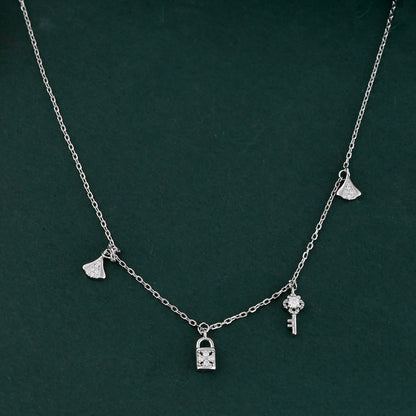 Sterling Silver Lock & Key Charm Necklace – Dainty CZ Padlock, Key & Ginkgo Leaf Pendant Choker