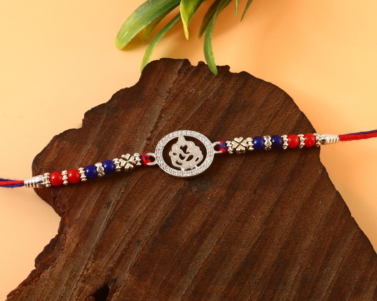 Silver Ganesh Ji Rakhi | Religious Rakhi with CZ Studded Frame | Raksha Bandhan Gift - Zirak Silver